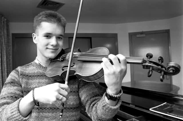 Martyn Bennett plays the violin at the City of Edinburgh Music School at Broughton High School. Picture: Albert Jordan 