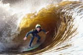 A surfer catches a wave at the Lost Shore Surf Resort (Picture: Jeff J Mitchell)