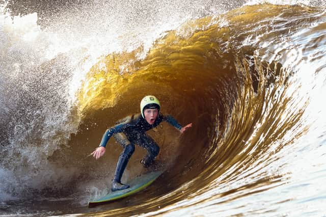 A surfer catches a wave at the Lost Shore Surf Resort (Picture: Jeff J Mitchell)