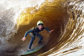 A surfer catches a wave at the Lost Shore Surf Resort (Picture: Jeff J Mitchell)