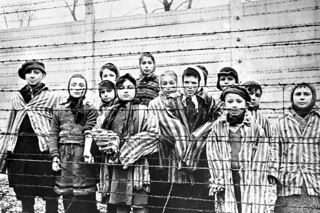 A group of child survivors at the Auschwitz-Birkenau Nazi concentration camp, on the day of its liberation by the Red Army, January 27, 1945 (Picture: Alexander Vorontsov)