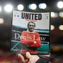 Manchester United paid tribute to Denis Law with a special edition of their match programme for the Europa League fixture against Rangers at Old Trafford. (Photo by Alan Harvey / SNS Group)