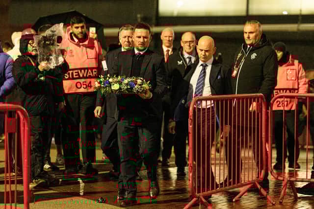 Rangers legend Barry Ferguson, Rangers CEO Patrick Stewart and chairman Fraser Thornton lay a wreath in memory of Denis Law.