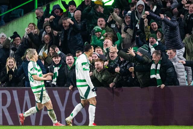 Celtic's Adam Idah (R) celebrates as his shot rebounds off Loris Benito and into the net to make it 1-0 against Young Boys. Cr: SNS Group.