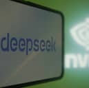 This photo illustration shows the DeepSeek and Nvidia logos on screens in Hangzhou, in China's eastern Zhejiang province on January 27, 2025