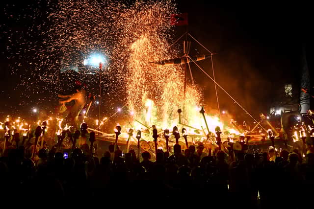 Members of the Up Helly Aa 'Jarl Squad' set fire to their galley boat during the torchlit procession through the streets of Lerwick, Shetland, in 2024. PIC: Andy Buchanan/Getty.