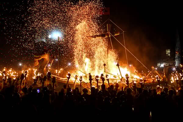 Members of the Up Helly Aa 'Jarl Squad' set fire to their galley boat during the torchlit procession through the streets of Lerwick, Shetland, in 2024. PIC: Andy Buchanan/Getty.