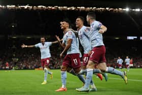 Jacob Ramsey and John McGinn celebrate Olly Watkins goal at Manchester United earlier in the season. Cr: Getty Images.