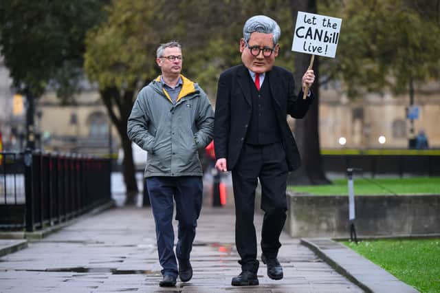 Celebrity chef and environmental campaigner Hugh Fearnley-Whittingstall walks with a man dressed as Prime Minister Sir Keir Starmer during a protest to urge MPs to back the Climate and Nature Bill