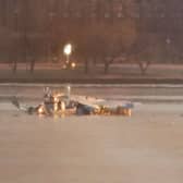 Emergency response units search the crash site of the American Airlines plane on the Potomac River after the plane crashed on approach to Reagan National Airport.