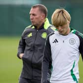 Kyogo Furuhashi and Brendan Rodgers during a Celtic training session at Lennoxtown. (Photo by Craig Williamson / SNS Group)