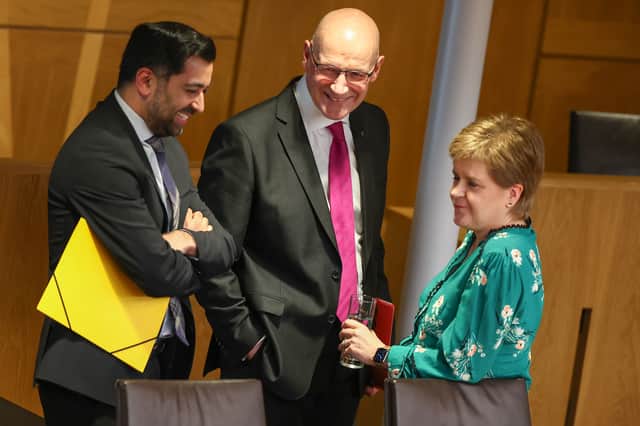 Nicola Sturgeon, John Swinney and Humza Yousaf chat after the latter's farewell speech as First Minister in May last year (Picture: Jeff J Mitchell)