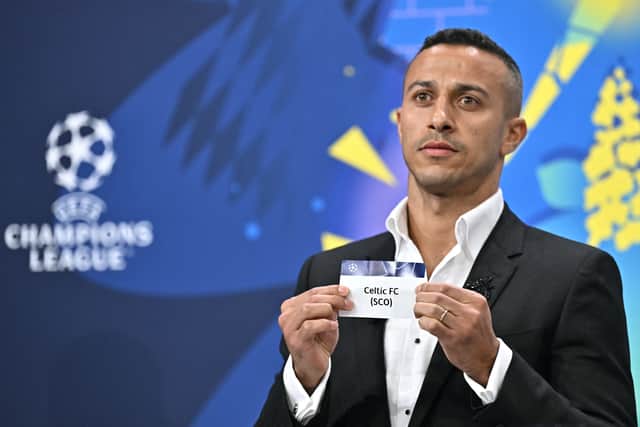 Former Spanish player Thiago Alcantara pulls Celtic out of the hat in the draw for the Champions League play-off round. (Photo by FABRICE COFFRINI/AFP via Getty Images)