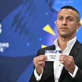 Former Spanish player Thiago Alcantara pulls Celtic out of the hat in the draw for the Champions League play-off round. (Photo by FABRICE COFFRINI/AFP via Getty Images)