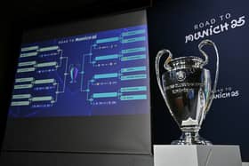 The Uefa Champions League trophy is on display during the knockout play-off draw at the House of European football in Nyon, on January 31, 2025.