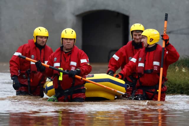 A Coastguard rescue team wades through floodwaters in Brechin in October 2023 to check on people who stayed in their homes (Picture: Jeff J Mitchell)