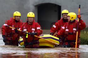 A Coastguard rescue team wades through floodwaters in Brechin in October 2023 to check on people who stayed in their homes (Picture: Jeff J Mitchell)