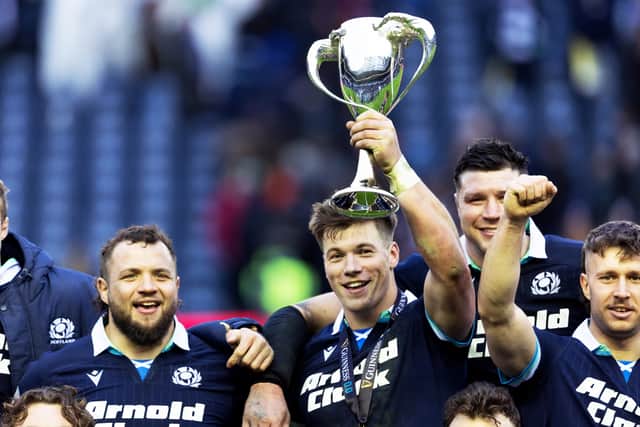 Scotland's Huw Jones with the The Cuttitta Cup after scoring a hat-trick in the Six Nations win over Italy. (Photo by Ross MacDonald / SNS Group)