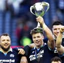 Scotland's Huw Jones with the The Cuttitta Cup after scoring a hat-trick in the Six Nations win over Italy. (Photo by Ross MacDonald / SNS Group)