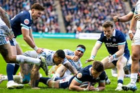 Huw Jones scores Scotland's fifth try and seals his hat-trick in the Six Nations win over Italy at Murrayfield. (Photo by Craig Williamson / SNS Group)