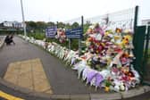 Flowers outside Cults Academy in Aberdeen where 16-year-old Bailey Gwynne died after being stabbed in 2015 (Picture:  Andrew Milligan)