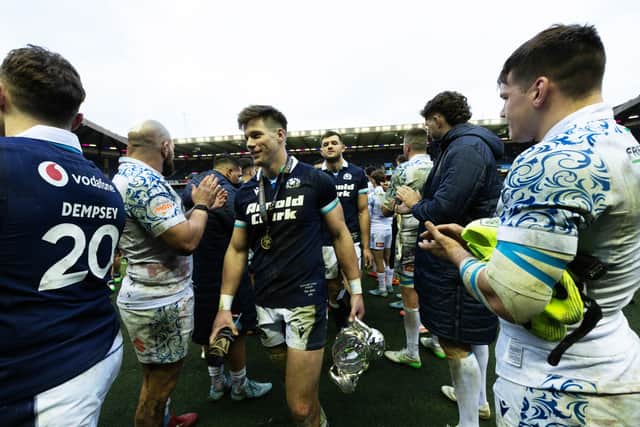 Scotland's Huw Jones takes applause after his performance against Italy.