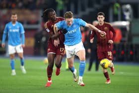Napoli's Scott McTominay is challenged by Manu Kone of Roma at the Stadio Olimpico.
