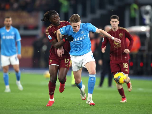 Napoli's Scott McTominay is challenged by Manu Kone of Roma at the Stadio Olimpico.