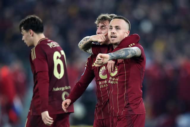 Angelino celebrates his late leveller for Roma.