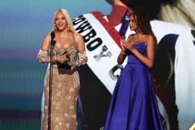 Beyoncé accepts the Album of the Year award for Cowboy Carter with Blue Ivy Carter onstage during the 67th Annual GRAMMY Awards.