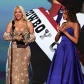 Beyoncé accepts the Album of the Year award for Cowboy Carter with Blue Ivy Carter onstage during the 67th Annual GRAMMY Awards.