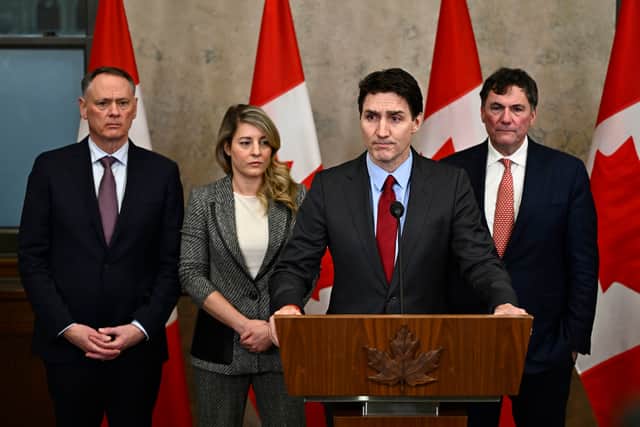Canada's Prime Minister Justin Trudeau addresses media following the imposition of a raft of tariffs by U.S. President Donald Trump against Canada, Mexico and China, in Ottawa, Saturday, Feb. 1, 2025
