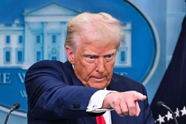 US President Donald Trump takes questions during a briefing about the mid-air crash between American Airlines flight 5342 and a military helicopter in Washington, in the Brady Press Briefing Room at the White House on January 30, 2025 in Washington, DC