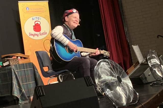 Folk singer Artie Trezise still tours under the banner of The Singing Kettle. 