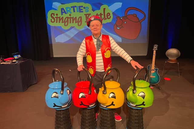 Folk singer Artie Trezise still tours under the banner of The Singing Kettle. 