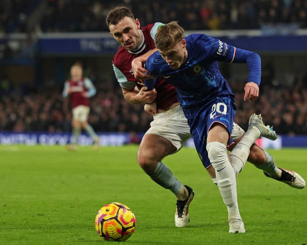 West Ham's Andy Irving challenges Chelsea's Cole Palmer during his first Premier League start. (Photo by ADRIAN DENNIS/AFP via Getty Images)          