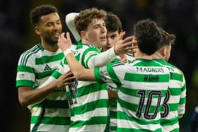 Celtic's Arne Engels (C) celebrates scoring to make it 5-0 over Dundee with teammates Auston Trusty (L) and Nicolas Kuhn.  (Photo by Craig Foy / SNS Group)