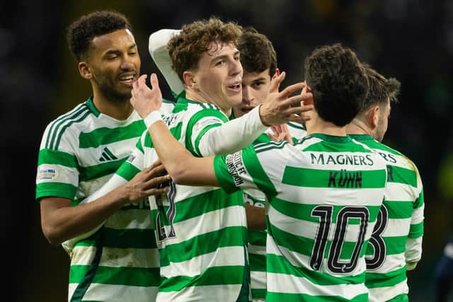 Celtic's Arne Engels (C) celebrates scoring to make it 5-0 over Dundee with teammates Auston Trusty (L) and Nicolas Kuhn. (Photo by Craig Foy / SNS Group)