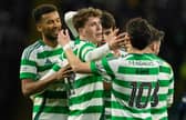 Celtic's Arne Engels (C) celebrates scoring to make it 5-0 over Dundee with teammates Auston Trusty (L) and Nicolas Kuhn.  (Photo by Craig Foy / SNS Group)