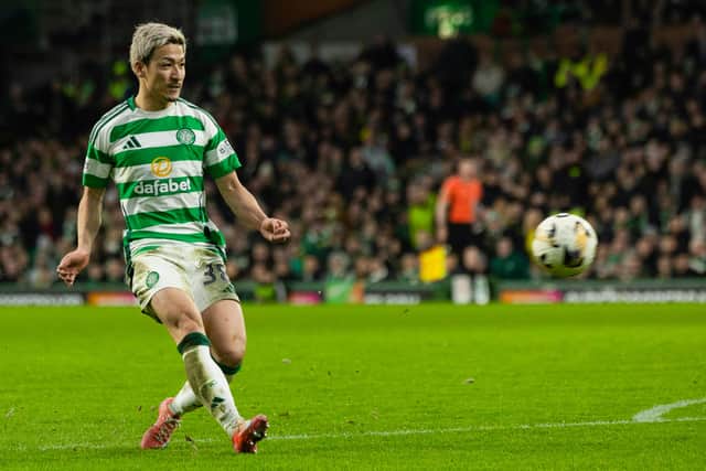 Celtic's Daizen Maeda scores to make it 4-0 with a chip over Dundee goalkeeper Trevor Carson. (Photo by Craig Foy / SNS Group)