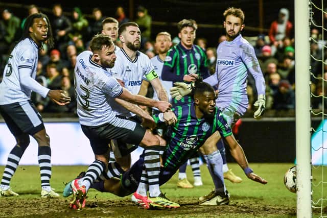 Hibs defender Rocky Bushiri heads home a late winner against Ayr United in the Scottish Cup. (Photo by Rob Casey / SNS Group)