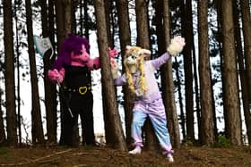 Furries pose in the trees near the convention centre.