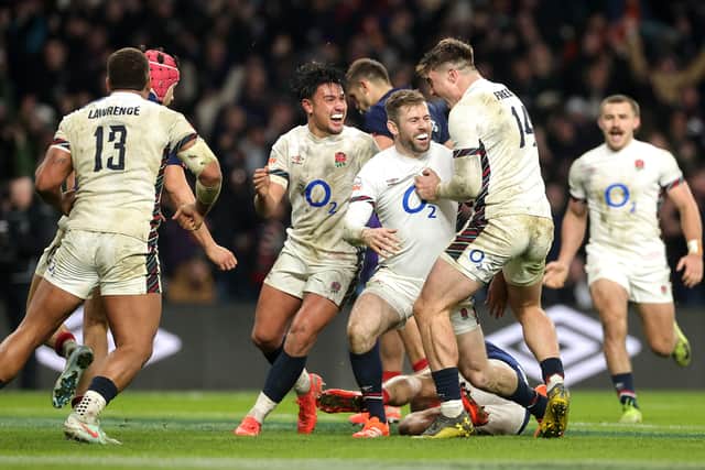 Elliot Daly of England celebrates with team mates after scoring their late fourth try in the Six Nations win over France.