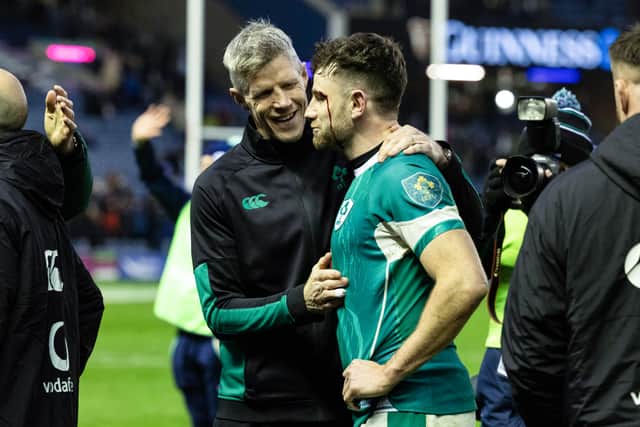 Ireland head coach Simon Easterby congratulates Hugo Keenan at full time.