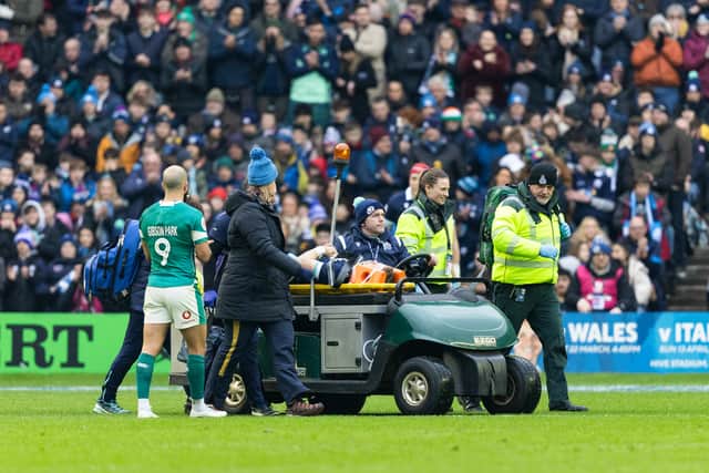 Darcy Graham is taken off on a stretcher during Scotland's defeat by Ireland.