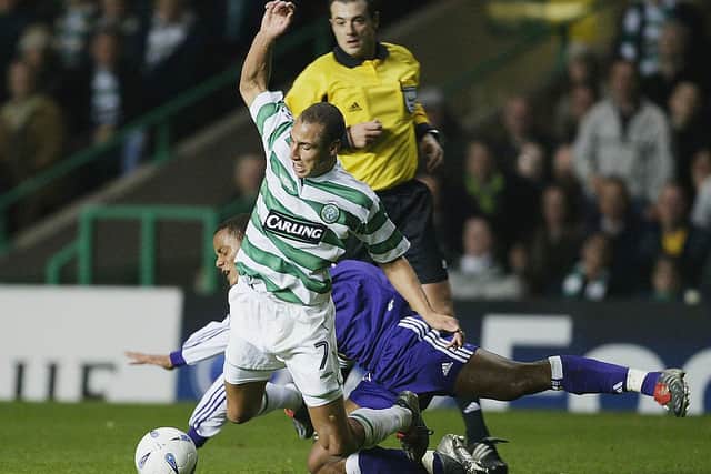 Vincent Kompany tackles Celtic legend Henrik Larsson on his last visit to Celtic Park in 2003.