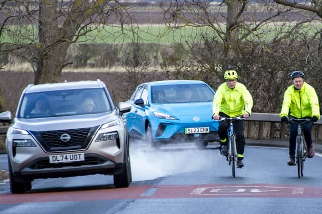 Drem-Gullane path campaigner Iain Monk, left, rides with The Scotsman Transport Correspondent Alastair Dalton on the B1345 near Drem