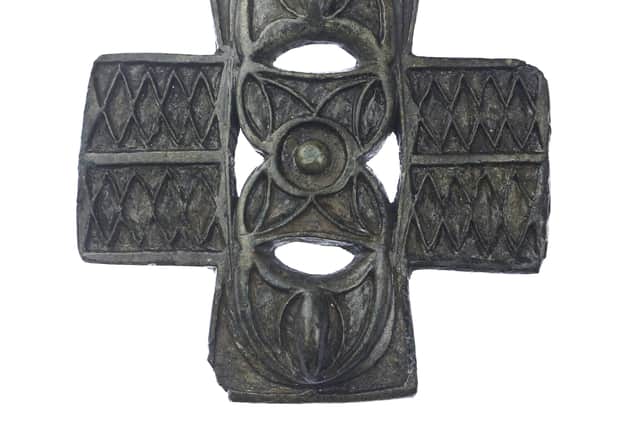 A Harness Strap mount found by archaeologists at Culduthel near Inverness ahead of housebuilders moving onto the site. Dating from 2nd Century AD, it has unfinished ‘cells’ which would have been completed at the Iron Age village by glass workers. PIC: Headland Archaeology.