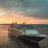 Borealis at sea at sunset