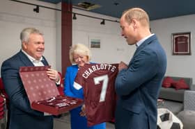 Prince William was presented with Hearts football shirts for his children during a visit to the Edinburgh club to see how SAMH's 'The Changing Room' mental health project works in 2022 (Picture: Jane Barlow/WPA pool)